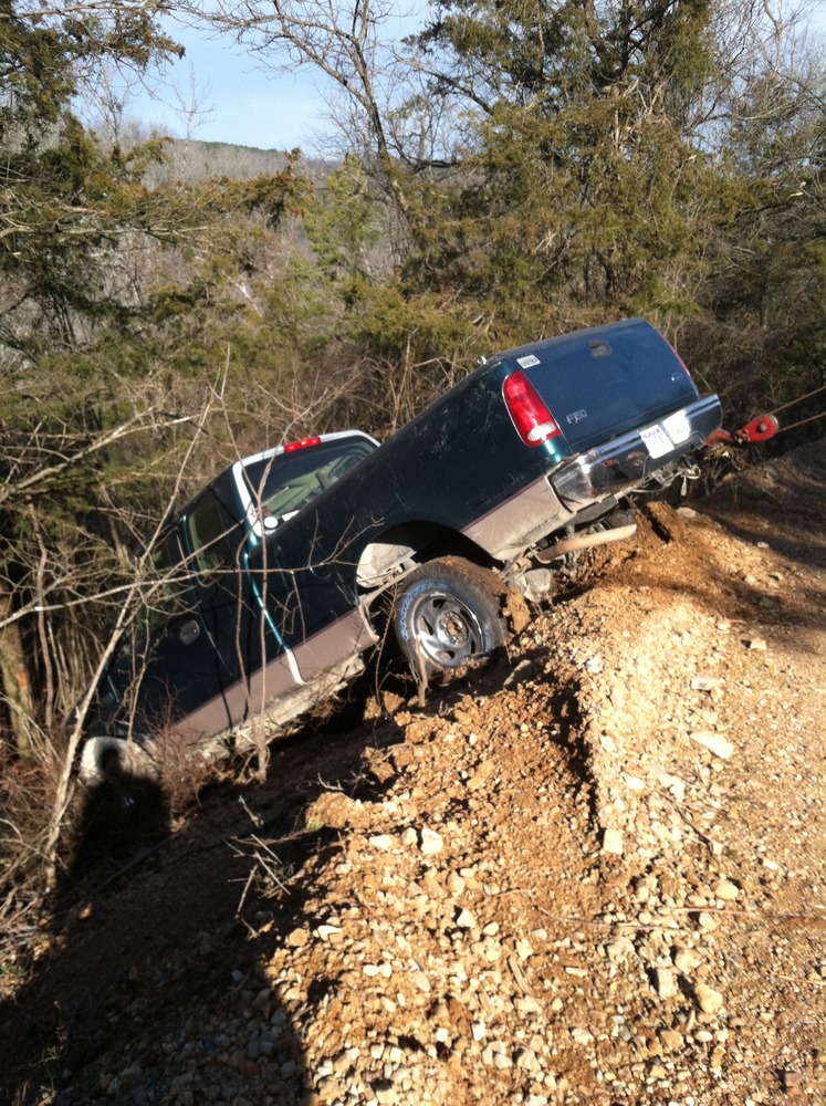 Recovering truck from down a hill in the woods